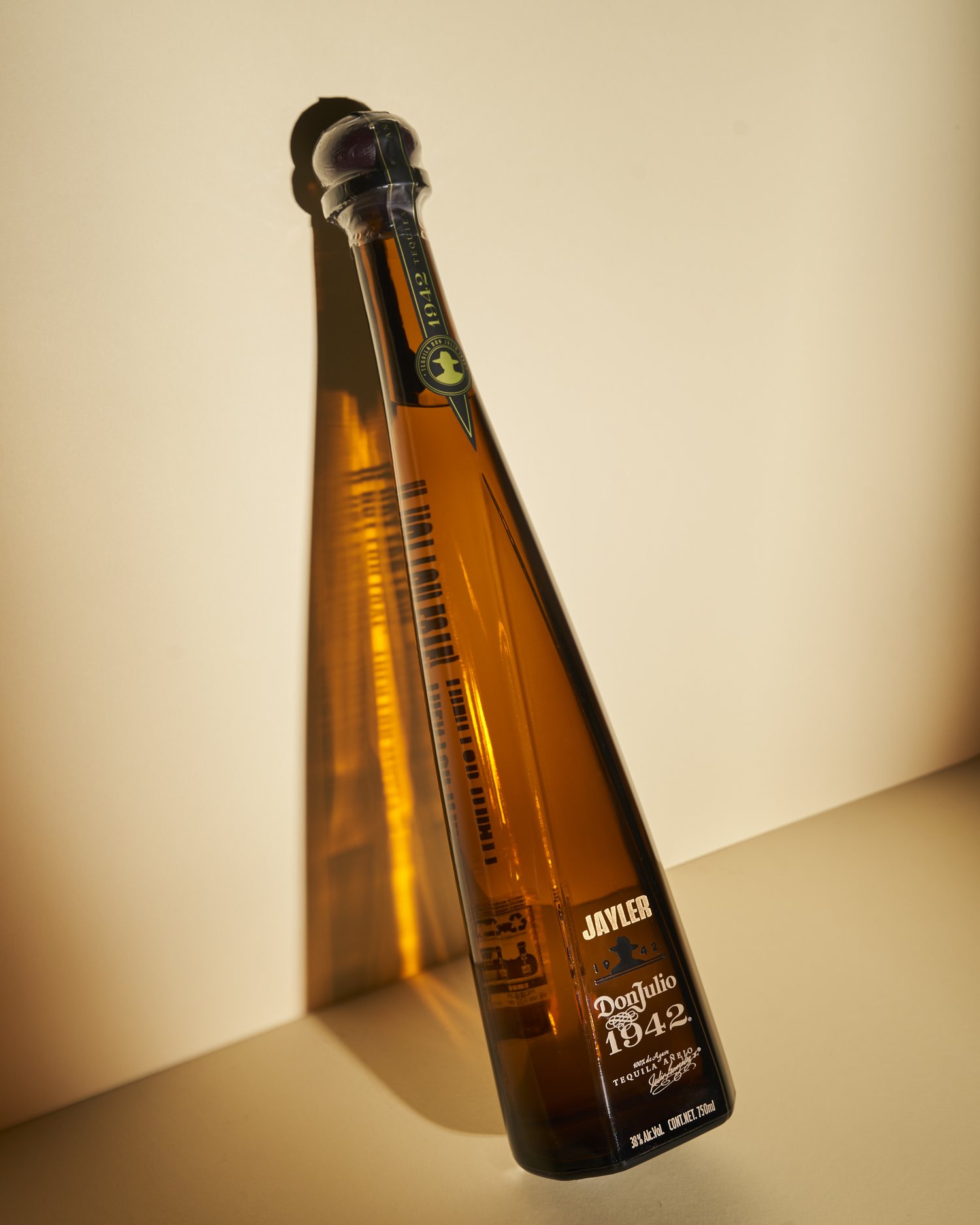 Don Julio 1942 — bottle on cream